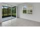 Bright living room with tiled floors and a view of the backyard at 6863 Tussilago Way, Orlando, FL 32822