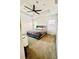 Bright and airy bedroom showcasing a ceiling fan and a comfortable queen-sized bed at 6863 Tussilago Way, Orlando, FL 32822
