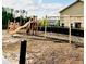 Community playground featuring play equipment, a slide, and swings at 6863 Tussilago Way, Orlando, FL 32822