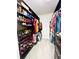 Walk-in closet featuring custom shelving and storage for clothing and shoes at 6863 Tussilago Way, Orlando, FL 32822