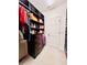 Organized walk-in closet featuring ample storage and custom shelving units at 6863 Tussilago Way, Orlando, FL 32822