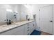 Bright bathroom with dual sinks, granite countertops, and a walk-in shower at 779 Firerock Ln, Debary, FL 32713