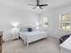 Comfortable bedroom with carpet floors, natural lighting, and serene ambiance at 779 Firerock Ln, Debary, FL 32713