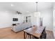 Open-concept living space featuring a table with chairs and a large couch at 779 Firerock Ln, Debary, FL 32713
