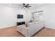 Bright living room with a comfortable couch, wood floors, and lots of natural light at 779 Firerock Ln, Debary, FL 32713
