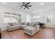 Open-concept living space featuring a large sectional couch and tile floors at 779 Firerock Ln, Debary, FL 32713