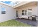 Outdoor patio features a grill and seating area, ideal for relaxation and entertainment at 779 Firerock Ln, Debary, FL 32713