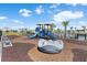 Community playground with a slide, benches, and surrounding palm trees in an attractive neighborhood at 779 Firerock Ln, Debary, FL 32713