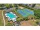 Community pool, tennis courts, and lounge chairs, providing luxurious outdoor amenities for the residents at 8061 Bangle Ln, Orlando, FL 32836