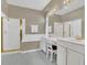 A bright bathroom with a double vanity, tub, and a separate shower at 8061 Bangle Ln, Orlando, FL 32836