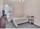 Inviting bedroom with a comfortable bed, natural light, and a view of the outdoors at 8061 Bangle Ln, Orlando, FL 32836