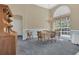 Traditional dining room featuring a large window, and ample lighting at 8061 Bangle Ln, Orlando, FL 32836
