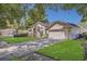Beautiful single-Gathering home featuring manicured lawn and mature trees at 8061 Bangle Ln, Orlando, FL 32836