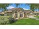 Charming home featuring a well-manicured lawn, mature landscaping, and an inviting front facade at 8061 Bangle Ln, Orlando, FL 32836