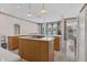 Spacious kitchen with white countertops, wood cabinets, and a breakfast bar overlooking the dining area at 8061 Bangle Ln, Orlando, FL 32836