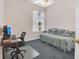 Comfortable home office with a daybed, desk, and natural light, ideal for work or relaxation at 8061 Bangle Ln, Orlando, FL 32836