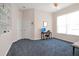 Spacious home office with natural light, a desk, and built-in shelving for storage and display at 8061 Bangle Ln, Orlando, FL 32836