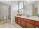 Bathroom featuring marble vanity and tiled floors at 9018 Southern Breeze Dr, Orlando, FL 32836
