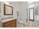 Bathroom features a modern vanity, toilet, and glass-enclosed shower at 9018 Southern Breeze Dr, Orlando, FL 32836