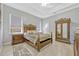 Bedroom features a tray ceiling, neutral walls, and traditional furnishings at 9018 Southern Breeze Dr, Orlando, FL 32836