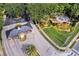 Aerial view of community entrance featuring lush landscaping, a guard house, and manicured grounds at 9018 Southern Breeze Dr, Orlando, FL 32836