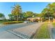 Gated community entrance with lush landscaping, offering security and curb appeal at 9018 Southern Breeze Dr, Orlando, FL 32836