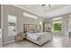 Airy main bedroom boasts abundant natural light and stylish furnishings at 9018 Southern Breeze Dr, Orlando, FL 32836
