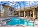 Inviting screened-in pool and spa, with brick paver deck and covered patio, perfect for outdoor living at 9018 Southern Breeze Dr, Orlando, FL 32836