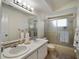 Bathroom featuring a double sink vanity and shower with glass doors at 29 Windsor Isle Dr, Longwood, FL 32779