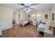 A large bedroom with dual beds and wood flooring at 29 Windsor Isle Dr, Longwood, FL 32779