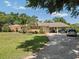 Traditional single Gathering home with a well-maintained lawn and carport at 29 Windsor Isle Dr, Longwood, FL 32779