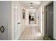 A wide hallway has storage closets and tile flooring at 29 Windsor Isle Dr, Longwood, FL 32779