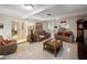 Open concept living room with wood paneling and tile flooring at 29 Windsor Isle Dr, Longwood, FL 32779