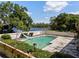 In-ground swimming pool with slide and lake views at 29 Windsor Isle Dr, Longwood, FL 32779