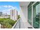 Balcony offers a view of city buildings and lush green trees at 101 S Eola Dr # 1018, Orlando, FL 32801