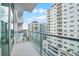 Balcony with glass railings provides panoramic views of the surrounding city buildings at 101 S Eola Dr # 1018, Orlando, FL 32801