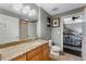 Bathroom featuring a granite countertop and neutral colored shower curtain at 101 S Eola Dr # 1018, Orlando, FL 32801