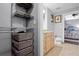 Bathroom featuring tan flooring, light wood cabinets, toilet, framed art and a walk-in closet at 101 S Eola Dr # 1018, Orlando, FL 32801