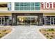 Elegant entrance to 101 EOLA featuring glass doors and modern architecture at 101 S Eola Dr # 1018, Orlando, FL 32801