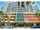 Modern high-rise building at 101 EOLA with sleek architecture and parking garage at 101 S Eola Dr # 1018, Orlando, FL 32801