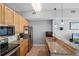 Spacious kitchen with granite countertops, stainless steel appliances, and ample counter space for food preparation at 101 S Eola Dr # 1018, Orlando, FL 32801