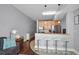 Well-lit kitchen with breakfast bar and seating, stainless steel appliances, and a view into the living space at 101 S Eola Dr # 1018, Orlando, FL 32801