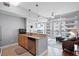 Open layout with kitchen granite countertops leading to a living room with large windows and outside view at 101 S Eola Dr # 1018, Orlando, FL 32801
