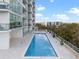 Resort-style rooftop pool with lounge area overlooking the city skyline at 101 S Eola Dr # 1018, Orlando, FL 32801