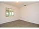 Spare bedroom with one window, linoleum floor, and white walls at 1125 N Mc Donald St, Mount Dora, FL 32757