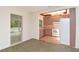 Classic kitchen with ample cabinet space and modern appliances; adjacent to a sunroom at 1125 N Mc Donald St, Mount Dora, FL 32757