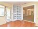 Bright sunroom with built-in shelving and views into the open living space at 1125 N Mc Donald St, Mount Dora, FL 32757