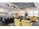 A spacious clubhouse featuring a kitchen, seating area, and stylish decor at 115 Crescent Moon Dr, Groveland, FL 34736