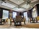 Common area with tables, chairs, and large windows providing natural light at 115 Crescent Moon Dr, Groveland, FL 34736