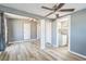 Spacious bedroom with wood floors, neutral walls, and updated ceiling fans at 1234 Parker Ave, Deltona, FL 32725